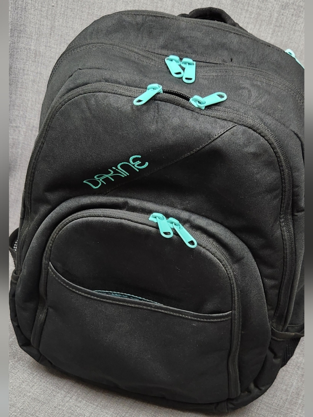 Dakine Black and Teal 3 Compartment Backpack.